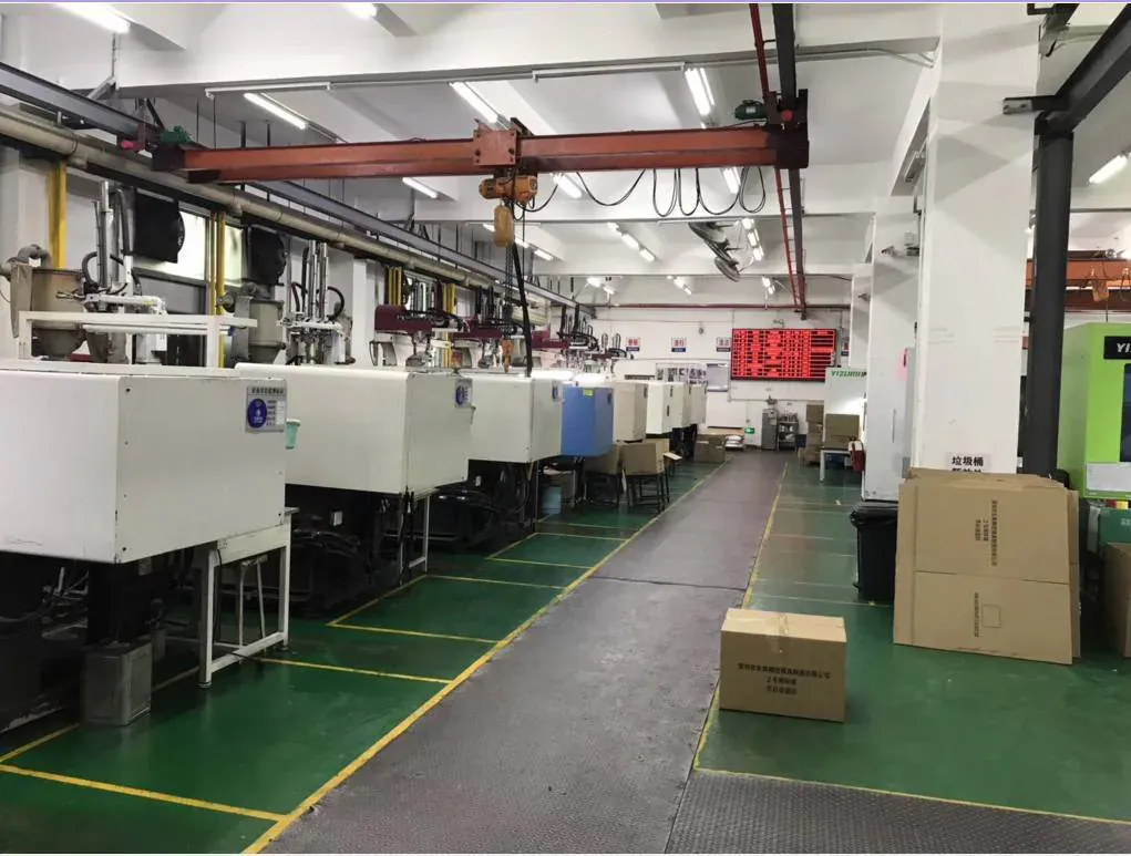 Injection molding machines arranged on a factory production floor