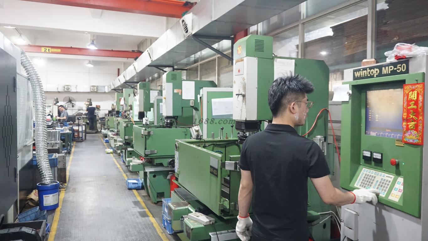 Technician machining a dining-set mold