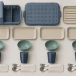 Four matching marina place settings and caddy parts arranged for counting