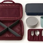 Open burgundy crew dining kit packing cube with graphite divider and fitted components