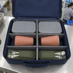 Open case layout for two boxes two tumblers and two utensil sleeves — AI-generated conceptual illustration