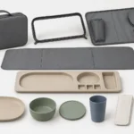 Exploded travel folio shell cradle placemat and tableware components