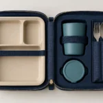 Compact rail meal service set secured inside a fitted navy case