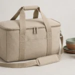 Closed sand beige insulated tote for the resort guest picnic kit