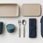 Compact rail meal service set components arranged in a flat lay
