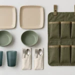 Two-person campervan dining kit components arranged in a clear flat lay