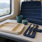 Compact rail meal service set arranged on a modern train table