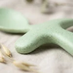 Macro view of natural organic wheat straw plant fiber specks on smooth food-grade flatware
